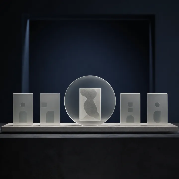 Frosted identity tiles protected by a circular privacy shield